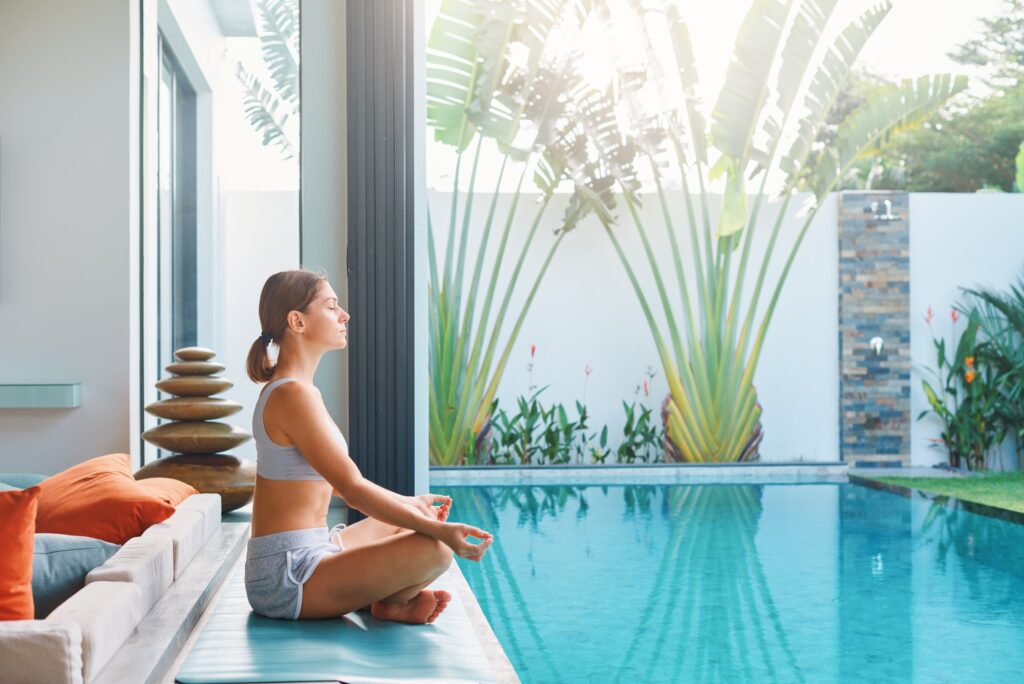 Meditation near swimming pool Morning time